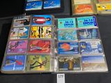 many different cd ' s on display on a table