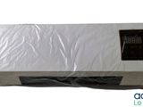 an air conditioner sitting on top of a plastic bag