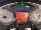 a close up of a speedometer on the dashboard of a motorcycle