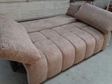 a couch that is sitting in a garage