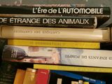 several books are stacked on top of each other on a table