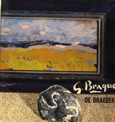 a picture of a painting and a rock on the ground