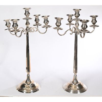 a pair of silver plated candelabs
