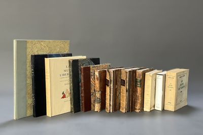 several books are stacked on top of each other on a table