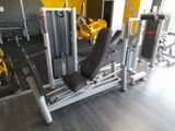 yellow and black gym equipment in a gym room with yellow walls