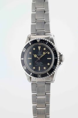 an image of a wrist watch with a black dial on a silver bracelet