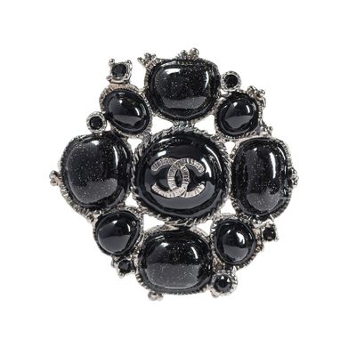 chanel brooch with black onyx stones and diamonds