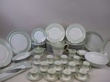 many different types of plates and bowls on the table