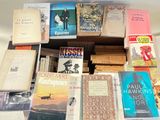 a lot of books that are on a table