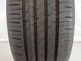 a close up of a tire on a white surface