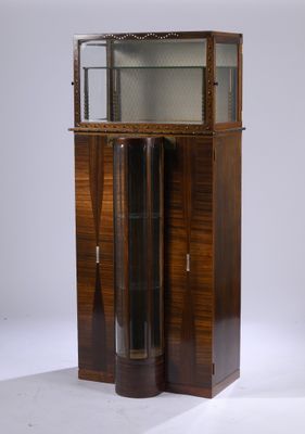 a tall wooden cabinet with a glass door on top