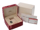 a box with a watch inside of it and a card in it