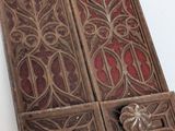 an old wooden door with a decorative design on it