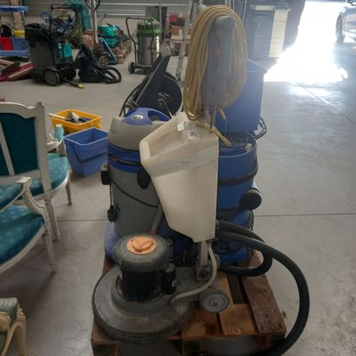 a machine that is sitting on a pallet in a garage