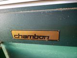 a close up of a green machine with a sign on it