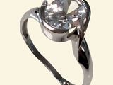 a ring with a large clear stone in it