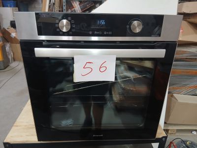a black and silver oven with a price tag on it