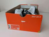 a box with a pair of shoes in it on a table