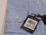 a picture of a blue dress shirt with a tag on it