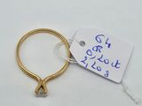 a gold ring with a diamond on it and a price tag