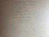 a piece of paper with writing on it sitting on a table