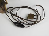 a cord with a plug attached to it on a white surface
