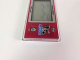 a small red electronic device on a white surface