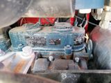 a close up view of a blue engine in a vehicle