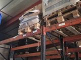 a man that is standing next to a pallet with boxes on it