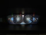 the dashboard of a car with a digital display on it