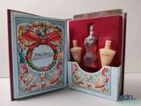 a small box with a bottle of perfume inside of it