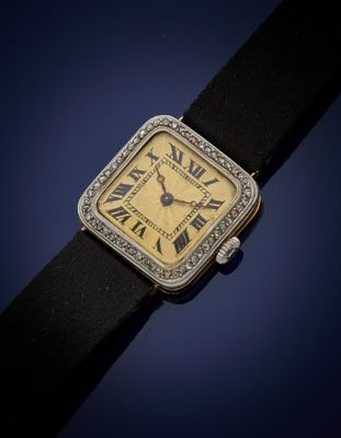 a close up of a wrist watch with roman numerals on it