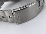 an image of a close up of a wrist watch on a white surface