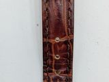 an image of a close up of a wrist watch on a white surface