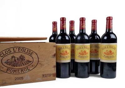 six bottles of red wine in a wooden crate on a white background