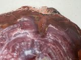 a close up of a piece of rock with a red vein on it