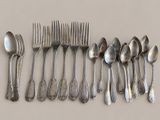 a lot of silver spoons and spoon spoons on a table