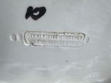 a white plate that has a black and white design on it