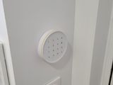 a white light on the wall next to a door