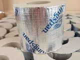 a roll of duct tape sitting on top of a pile of rolls of toilet paper