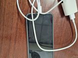 a cell phone that is connected to a charger