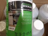 a bottle of liquid sitting on top of a cardboard box