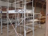 many scaffoldings in a building that are being built