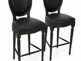 pair of black leather bar stools with round backrests
