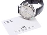 a watch that is sitting on top of a business card