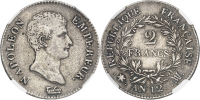 a silver coin with an image of a man on it