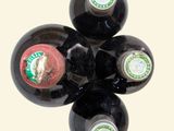 four bottles of wine sitting on top of each other