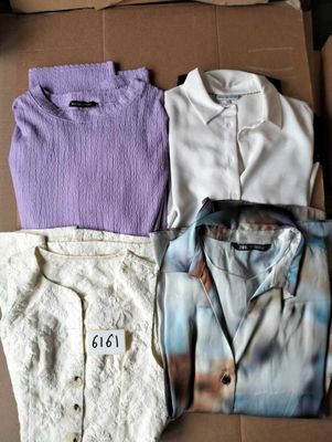 three men ' s shirts in a box with a price tag on them