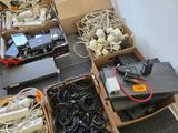 several boxes of electronics are sitting on the floor next to each other