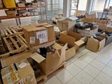 many boxes and boxes on the floor in a room